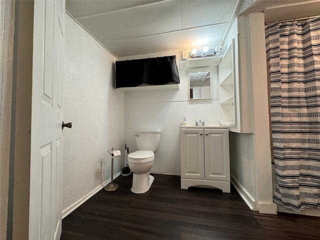 bathroom featuring vanity, toilet, a shower with curtain, and hardwood / wood-style floors