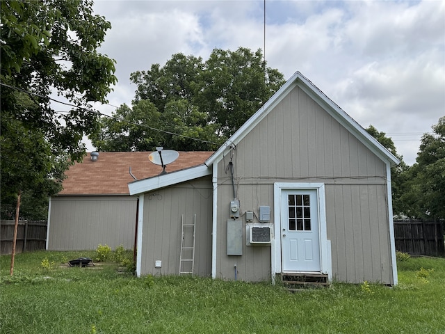 view of outbuilding featuring a lawn