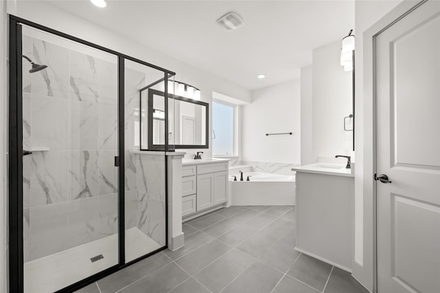 bathroom with tile patterned floors, separate shower and tub, and vanity