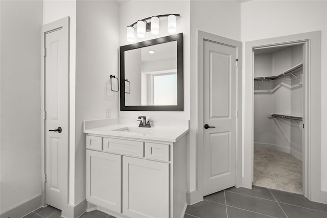 bathroom with tile patterned flooring and vanity