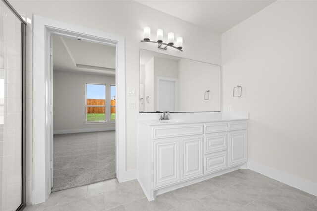 bathroom with tile patterned floors and vanity