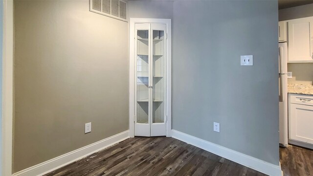 spare room featuring hardwood / wood-style floors