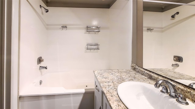 bathroom featuring vanity and shower / bath combination