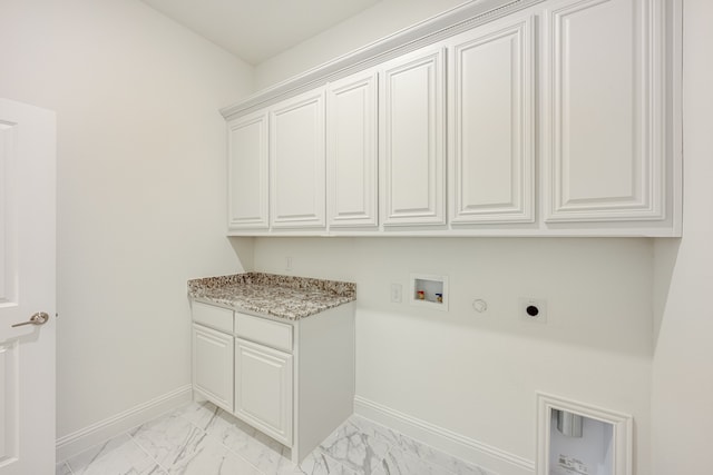 laundry room with hookup for an electric dryer, cabinets, gas dryer hookup, and hookup for a washing machine