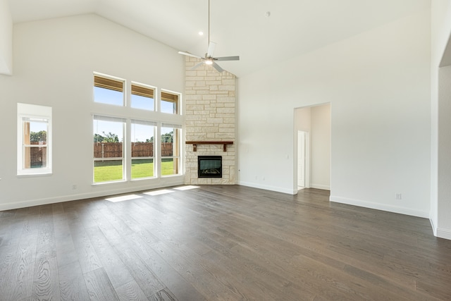 unfurnished living room featuring dark hardwood / wood-style floors, high vaulted ceiling, and a wealth of natural light