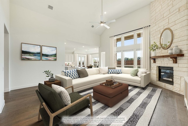 living room featuring ceiling fan, a fireplace, high vaulted ceiling, and dark hardwood / wood-style flooring