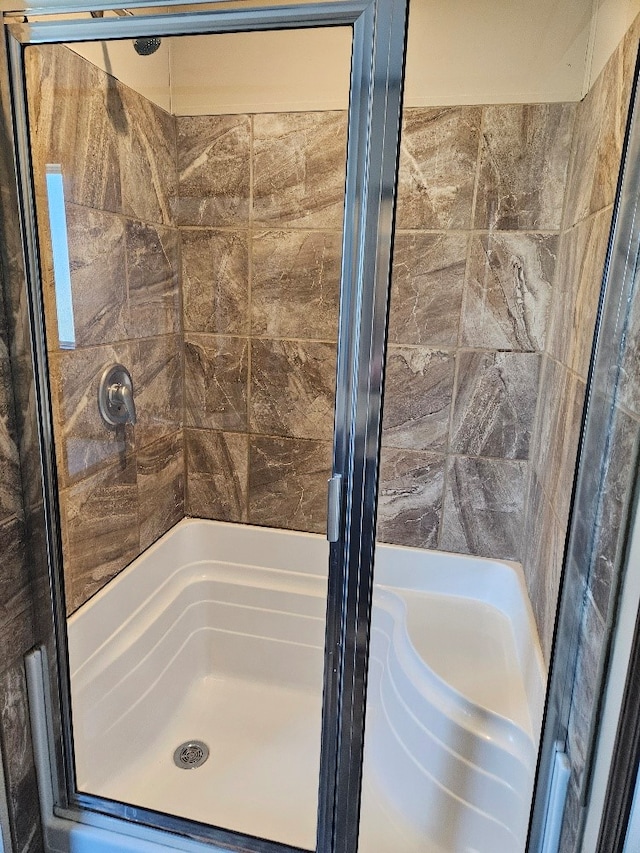 bathroom with a stall shower