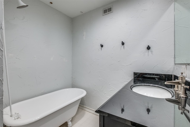 bathroom featuring a bathing tub and vanity