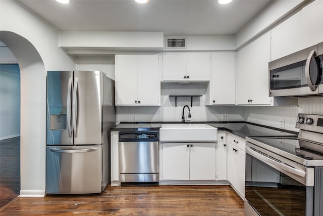 kitchen with white cabinetry, sink, and stainless steel appliances