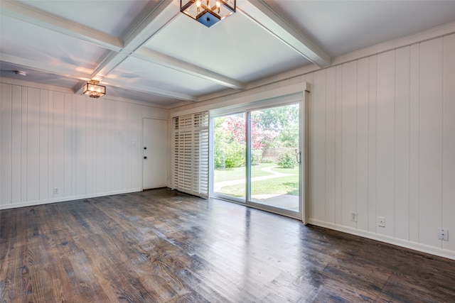 empty room with beam ceiling, crown molding, dark wood-type flooring, and coffered ceiling