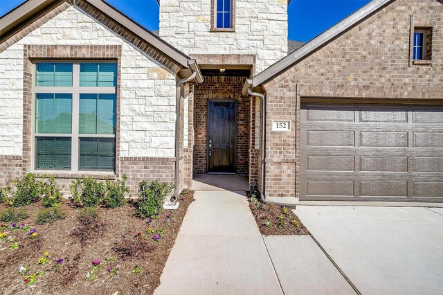 view of front of home with a front yard and a garage