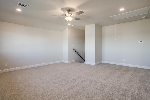 unfurnished room featuring ceiling fan and light colored carpet