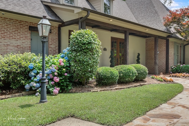 view of property exterior with a yard