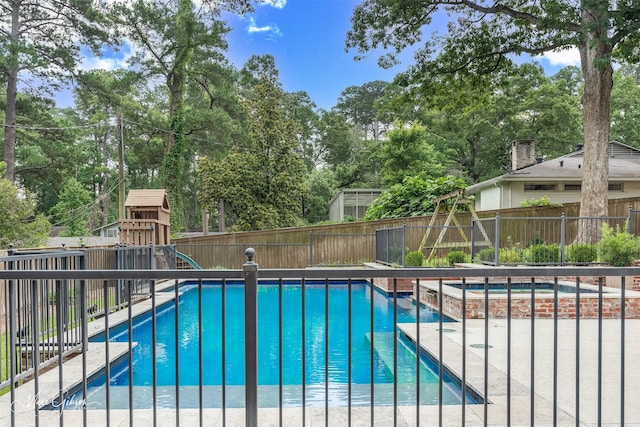 view of pool featuring a playground