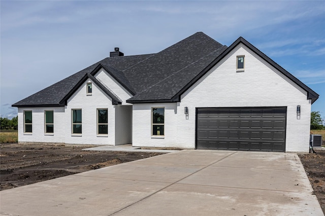 view of front of home featuring central AC unit