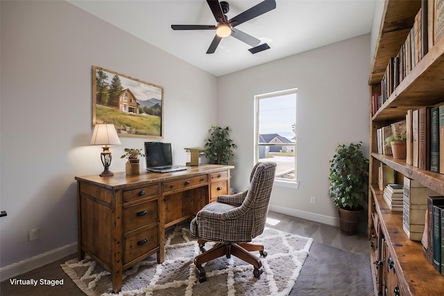 office featuring carpet and ceiling fan