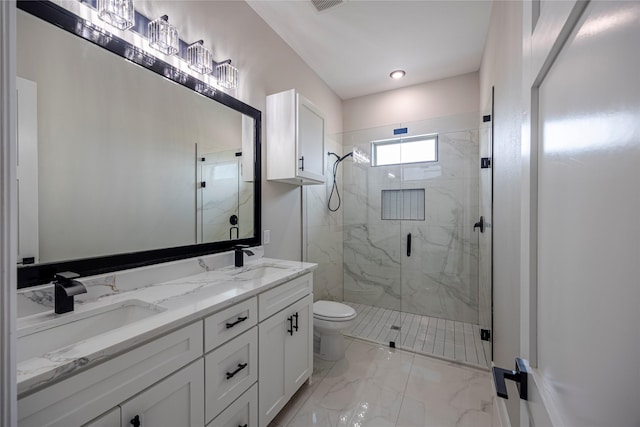 bathroom with a shower with door, vanity, and toilet