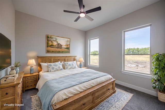 bedroom featuring lofted ceiling, ceiling fan, and dark colored carpet