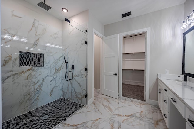 bathroom featuring vanity and a shower with shower door