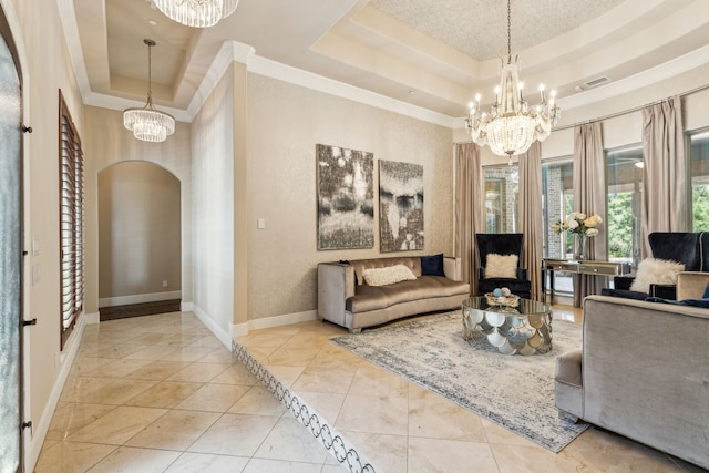 tiled living room featuring a raised ceiling, crown molding, and a chandelier