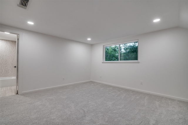 empty room featuring light colored carpet