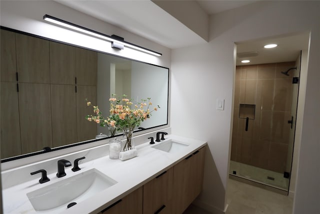 bathroom featuring vanity and an enclosed shower