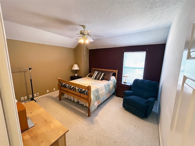 bedroom featuring carpet, ceiling fan, and a textured ceiling