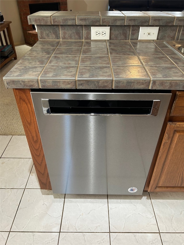 room details with dishwasher and tile patterned floors