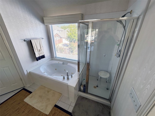 bathroom with plus walk in shower and tile patterned flooring