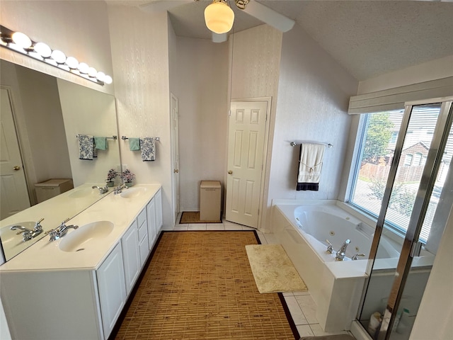 full bathroom with vaulted ceiling, vanity, tile patterned flooring, separate shower and tub, and toilet