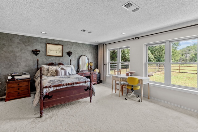 carpeted bedroom with a textured ceiling and crown molding