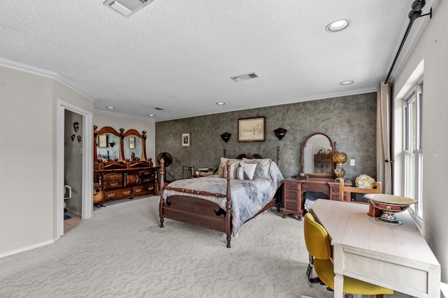 bedroom featuring crown molding, carpet, and a textured ceiling