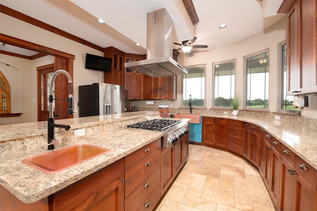 kitchen featuring light tile flooring, island exhaust hood, ceiling fan, light stone countertops, and appliances with stainless steel finishes