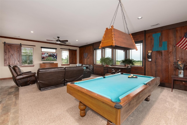 recreation room with a healthy amount of sunlight, wooden walls, billiards, and ceiling fan