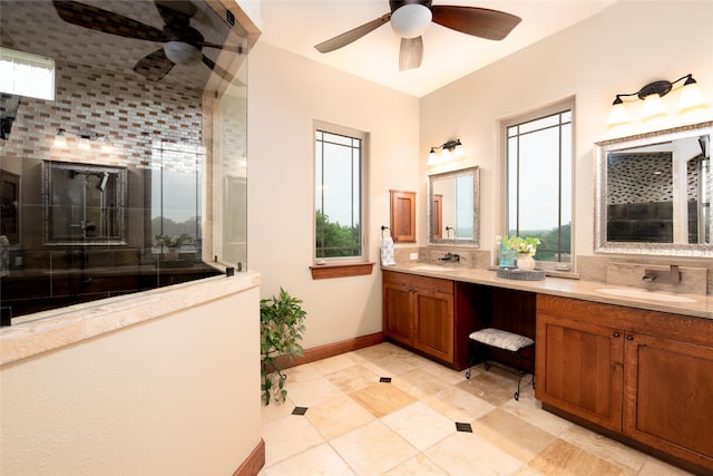 bathroom featuring a wealth of natural light, double vanity, ceiling fan, and tile floors