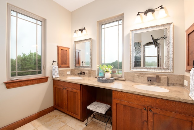 bathroom featuring tile floors, a wealth of natural light, and dual bowl vanity