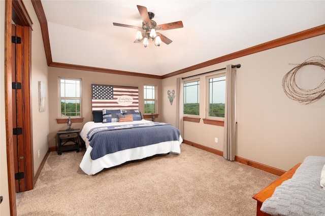 bedroom with ornamental molding, carpet floors, and ceiling fan