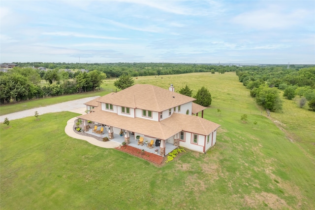 birds eye view of property featuring a rural view