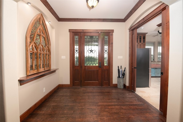 entryway featuring ornamental molding, ceiling fan, and hardwood / wood-style floors