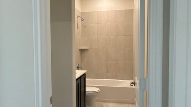 full bathroom with vanity, toilet, tile patterned floors, and tiled shower / bath