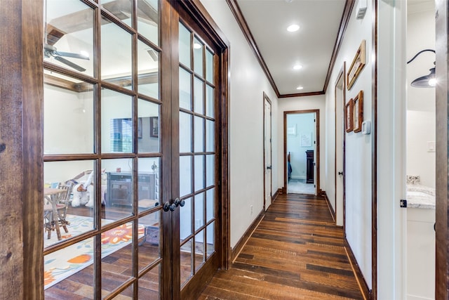 corridor with french doors, dark wood-type flooring, and ornamental molding