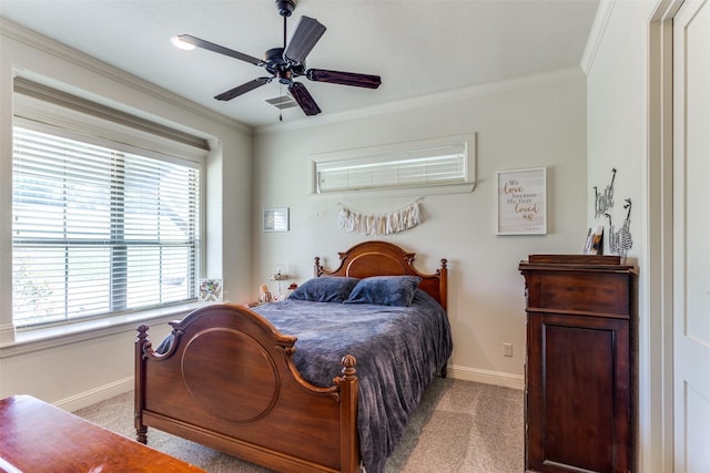 carpeted bedroom with multiple windows, ceiling fan, and crown molding