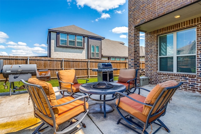 view of patio / terrace with grilling area and an outdoor fire pit