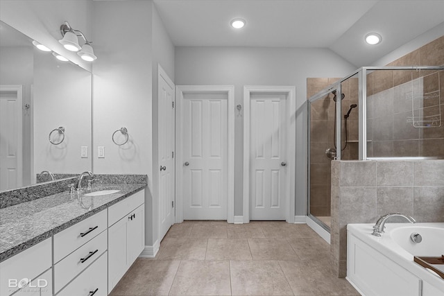 bathroom with vanity, tile patterned flooring, and separate shower and tub