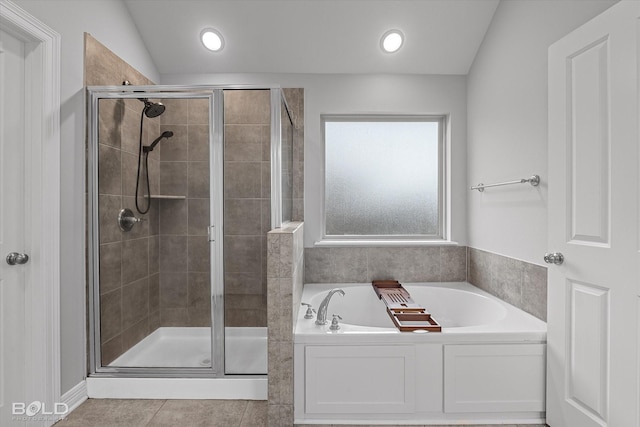 bathroom with lofted ceiling, tile patterned floors, and shower with separate bathtub