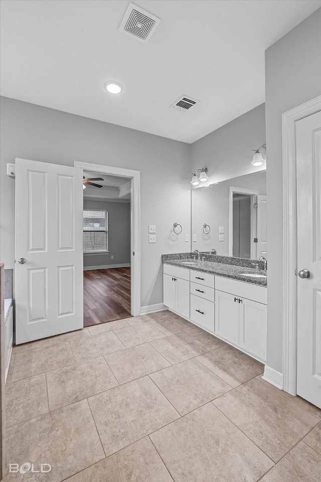 bathroom with ceiling fan, vanity, and tile patterned flooring