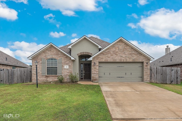 view of front of house with a garage and a front yard