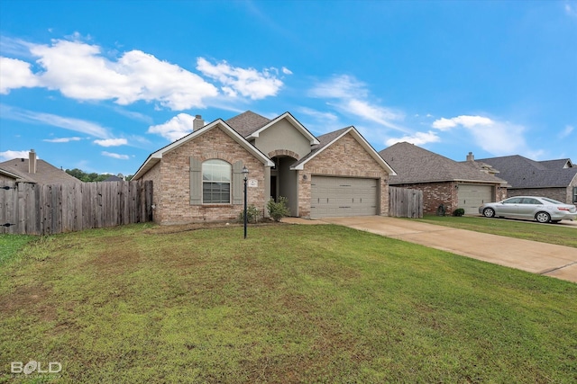 view of front of house featuring a garage and a front yard