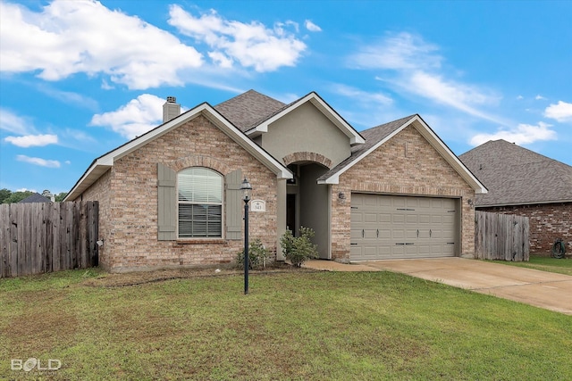 view of front of house with a garage and a front yard