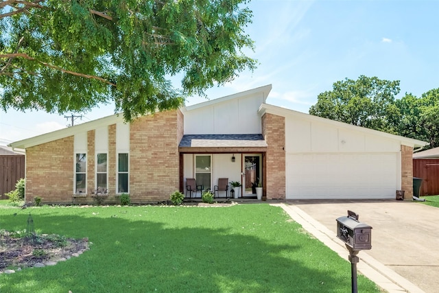 view of front of house featuring a garage and a front lawn